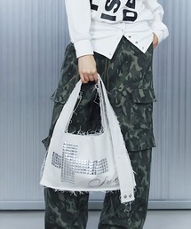 SETUPEXE（セットアップイーエックスイー）の「A'GEM/9 × .kom 『SETUPEXE/セットアップイーエックスイー』 TWO-WAY RAW CROSSBAG/スタッズクロスデザイン フリンジショルダーバッグ アイレットベルト付き（ショルダーバッグ）」