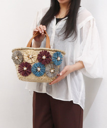 cache cache（カシュ カシュ）の「カシュカシュ cachecache / ラフィアフラワー付カゴバッグ（かごバッグ）」