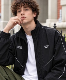 Reebok（リーボック）の「REEBOK パイピング ポケットジップ付き ナイロンジャケット（ナイロンジャケット）」