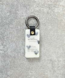 MILLION CARATS（ミリオンカラッツ）の「香り×デザインで心まで満たす《LibCurate》Mimosa WAX。バッグに揺れるたび広がるアロマの余韻で、自分らしさを持ち歩く。気分で選べる色柄と香りが、等身大の日常に小さな幸せをプラス。（チャーム）」