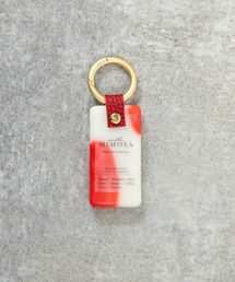 MILLION CARATS（ミリオンカラッツ）の「香り×デザインで心まで満たす《LibCurate》Mimosa WAX。バッグに揺れるたび広がるアロマの余韻で、自分らしさを持ち歩く。気分で選べる色柄と香りが、等身大の日常に小さな幸せをプラス。（チャーム）」