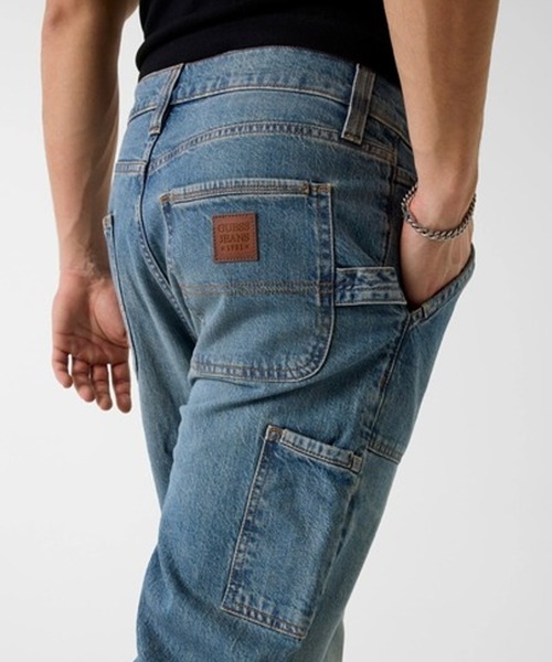 GUESS JEANS(ゲスジーンズ)の「GUESS JEANS/ゲスジーンズ GJ CLASSIC TINTED MEDIUM WASH デニムパンツ ジーンズ ジーパン 2026年 夏 夏服 秋服(デニムパンツ・メンズ・ブルー・32/30/34)」の4枚目の写真