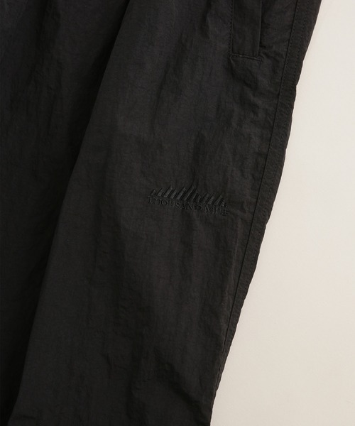 THOUSAND MILE(サウザンドマイル)の「THOUSAND MILE/別注 LIGHT SHELL WIDE PANTS(その他パンツ・メンズ・ブラック/パープル・L/S/M)」の9枚目の写真