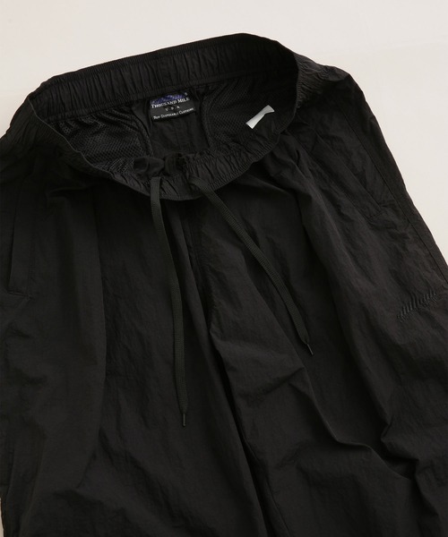 THOUSAND MILE(サウザンドマイル)の「THOUSAND MILE/別注 LIGHT SHELL WIDE PANTS(その他パンツ・メンズ・ブラック/パープル・L/S/M)」の11枚目の写真