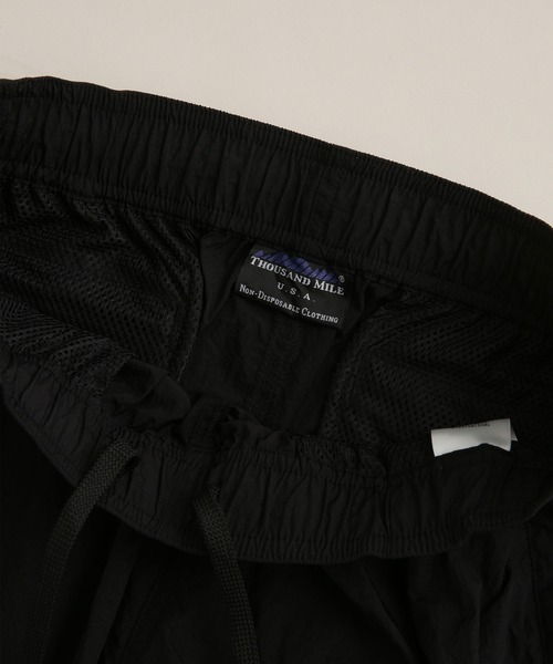 THOUSAND MILE(サウザンドマイル)の「THOUSAND MILE/別注 LIGHT SHELL WIDE PANTS(その他パンツ・メンズ・ブラック/パープル・L/S/M)」の12枚目の写真