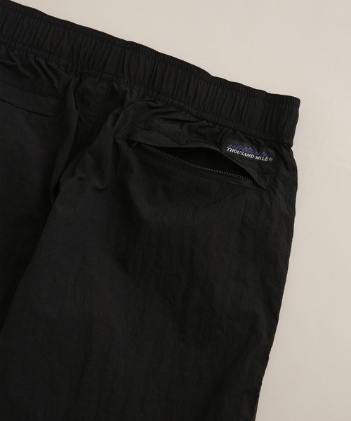 THOUSAND MILE(サウザンドマイル)の「THOUSAND MILE/別注 LIGHT SHELL WIDE PANTS(その他パンツ・メンズ・ブラック/パープル・L/S/M)」の15枚目の写真