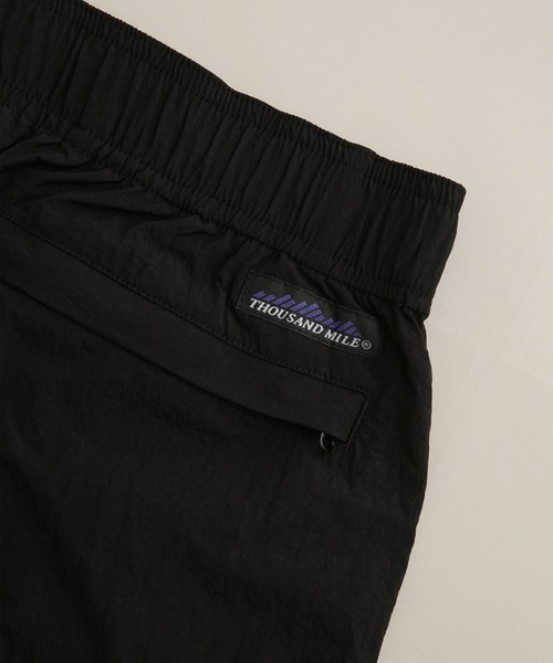 THOUSAND MILE(サウザンドマイル)の「THOUSAND MILE/別注 LIGHT SHELL WIDE PANTS(その他パンツ・メンズ・ブラック/パープル・L/S/M)」の16枚目の写真