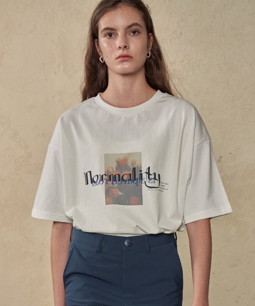 TRIP LE SENS(トリップ ル センス)の「UNISEX Normality Graphic T-shirts_White(Tシャツ/カットソー・レディース・その他・LARGE/MEDIUM)」の1枚目の写真