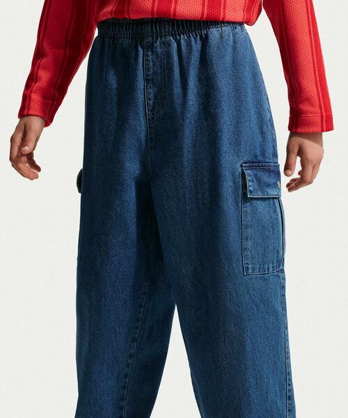 NIKE(ナイキ)の「ナイキ スポーツウェア コレクション ジュニア デニム カーゴ パンツ / Nike Sportswear Collection Big Kids' Denim Cargo Pants IO0197-461 Mystic Navy(デニムパンツ・キッズ・ブルー系その他・140/160/150)」の2枚目の写真