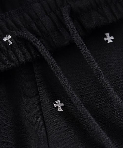 UNKNOWN LONDON(アンノウン・ロンドン)の「A'GEM/9 × .kom 『UNKNOWN LONDON/アンノウン ロンドン』 Tiny Cross Glitter Sweat Pants/タイクロス グリッター スウェットパンツ(スウェットパンツ・メンズ・オフホワイト/ブラック・S/M)」の8枚目の写真