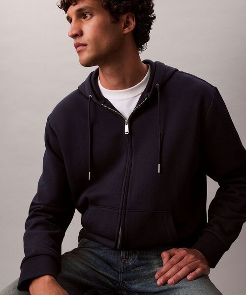 Calvin Klein(カルバン・クライン)の「ロングスリーブ アーカイブロゴ フリースジップパーカー(パーカー・メンズ・ネイビー/グレー/ブラック・S/L/M/XL)」の18枚目の写真