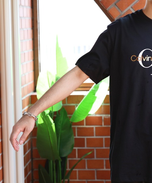 Calvin Klein(カルバン・クライン)の「Calvin Klein ゴールドモノグラム半袖Tシャツ(Tシャツ/カットソー・メンズ・ブラック系その他・MEDIUM/SMALL/LARGE)」の18枚目の写真
