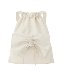 NDY（エヌディーワイ）の「リボンシャーリングドローストリングクリーム（バックパック/リュック）」