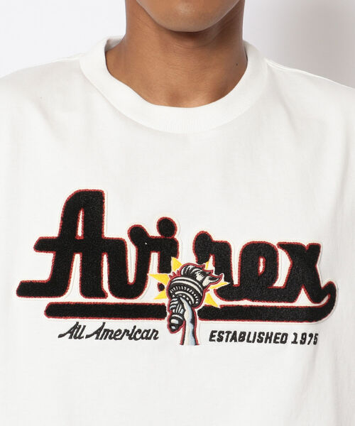 AVIREX（アヴィレックス）の「長袖 ヴァーシティ Tシャツ ロゴ&トーチ / LONG SLEEVE VARSITY T-SHIRT LOGO&TORCH / アヴィレックス / AVIREX（Tシャツ/カットソー・メンズ・ホワイト/レッド/ブラック・LARGE/MEDIUM/X-LARGE/XX-LARGE）」の6枚目の写真