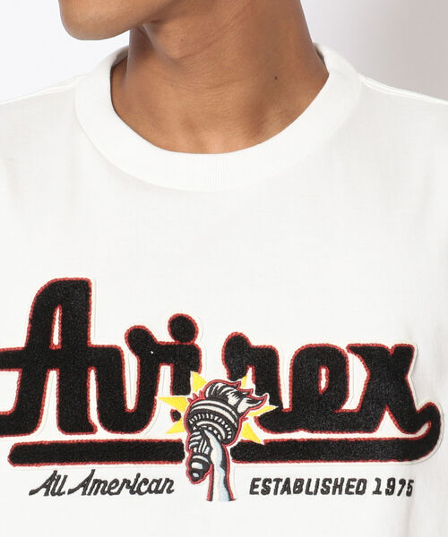 AVIREX（アヴィレックス）の「長袖 ヴァーシティ Tシャツ ロゴ&トーチ / LONG SLEEVE VARSITY T-SHIRT LOGO&TORCH / アヴィレックス / AVIREX（Tシャツ/カットソー・メンズ・ホワイト/レッド/ブラック・LARGE/MEDIUM/X-LARGE/XX-LARGE）」の7枚目の写真