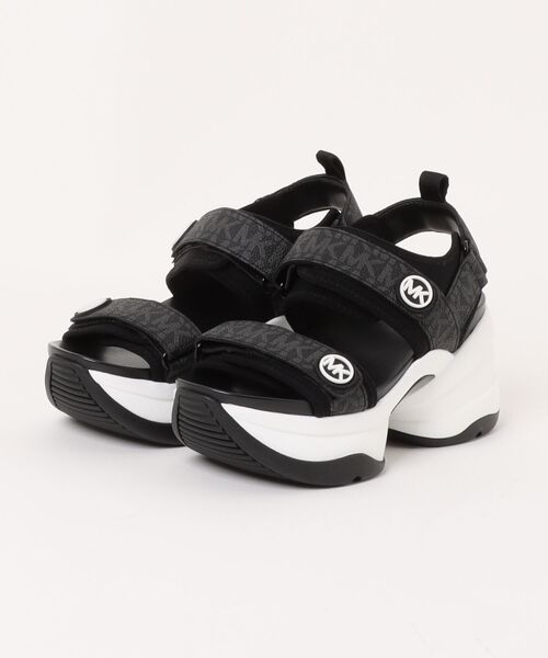 MICHAEL KORS(マイケルコース)の「OLYMPIA SANDAL サンダル(サンダル・レディース・ブラック・5.5/6/6.5/7/7.5/8)」の1枚目の写真