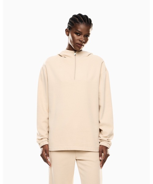 EMPORIO ARMANI EA7(エンポリオアルマーニイーエーセブン)の「<オンライン限定>【エンポリオ アルマーニ EA7】Sporty Forever フード付きスウェットシャツ コットン混紡(スウェット・レディース・ベージュ・SMALL/MEDIUM/LARGE)」の1枚目の写真