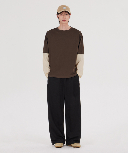 GLW（ジーエルダブリュ）の「[unisex] サイドライン トラックパンツ ブラック（スウェットパンツ・メンズ・その他・SMALL/MEDIUM/LARGE/X-LARGE）」の2枚目の写真