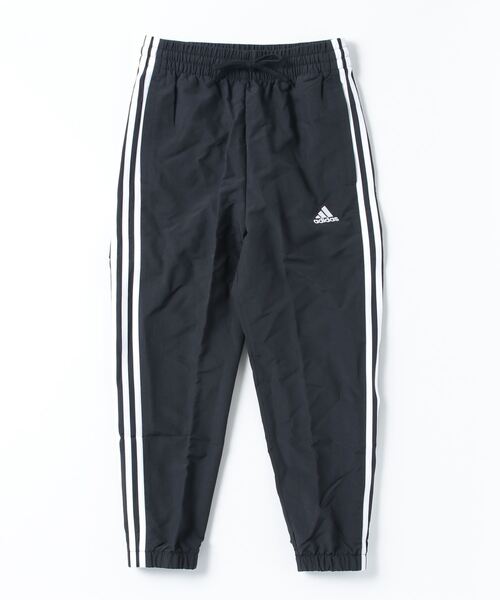 adidas(アディダス)の「アディダス adidas エッセンシャルズ スリーストライプス ウーブン 7/8丈パンツ(その他パンツ・レディース・ブラック・S/M/L/XL)」の1枚目の写真