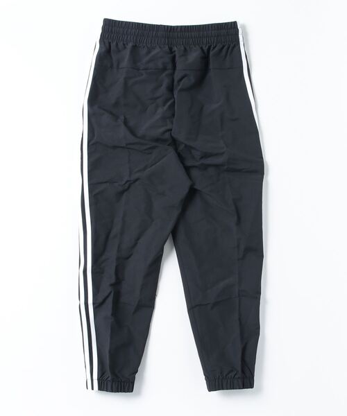 adidas(アディダス)の「アディダス adidas エッセンシャルズ スリーストライプス ウーブン 7/8丈パンツ(その他パンツ・レディース・ブラック・S/M/L/XL)」の2枚目の写真