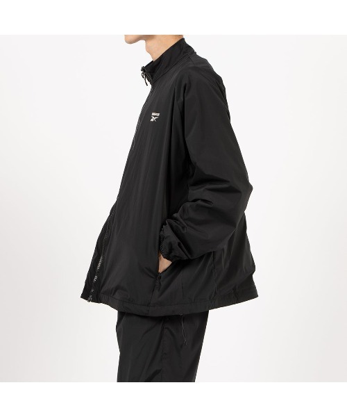 Reebok（リーボック）の「KANGHYUK ロゴ トラックジャケット / STITCHED LOGO TRACK JACKET（ナイロンジャケット・メンズ・グレー・LARGE）」の2枚目の写真