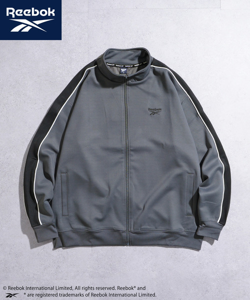 Reebok(リーボック)の「REEBOK 袖ライン 左胸エンブロイダリー トラックジャケット(Tシャツ/カットソー・メンズ・チャコールグレー/ネイビー/ブラック・X-LARGE/LARGE/MEDIUM)」の1枚目の写真