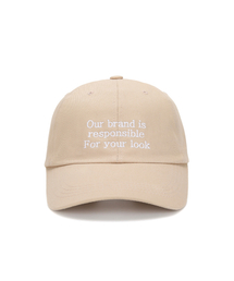 ULUK（ユルク）の「スローガン刺繍コットンボールキャップ_Beige（キャップ）」