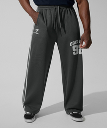 DRIX（ドリックス）の「(夏用) トラックライングラフィックメッシュワイドパンツ_チャコール（スウェットパンツ）」