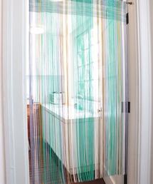 Amina（アミナ）の「【チャイハネ】シャララストリングのれん（インテリア雑貨）」