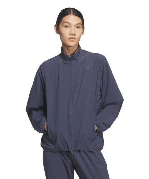 adidas(アディダス)の「アディダス adidas トレーニング エッセンシャルズ プラス ルーズフィット ストレッチ ウーブン ジャケット(ジャージ・レディース・ライトベージュ/ブラック/ネイビー・M/L)」の1枚目の写真