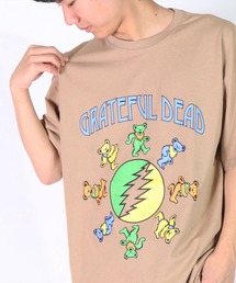 Grateful Dead（グレイトフルデッド）の「(DV)【Grateful Dead】ラウンドヘム ダンシング・ベアー プリント Tシャツ（Tシャツ/カットソー・メンズ）」