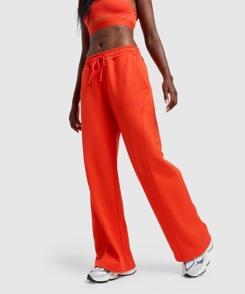 NEW BALANCE(ニューバランス)の「New Balance Klutch Women's Fleece Pant(ニューバランス クラッチ フリース パンツ)(スウェットパンツ・レディース・オレンジ系・SMALL/MEDIUM/LARGE)」の1枚目の写真