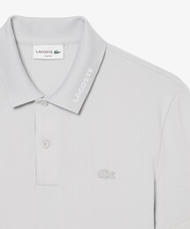 LACOSTE（ラコステ）の「ネームジャカードカラー ストレッチ鹿の子 半袖ポロシャツ（ポロシャツ）」
