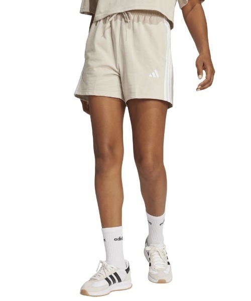 adidas(アディダス)の「アディダス adidas エッセンシャルズ スリーストライプス コットンショーツ(その他パンツ・レディース・ブラック/サンドグレー・S/M/L)」の1枚目の写真