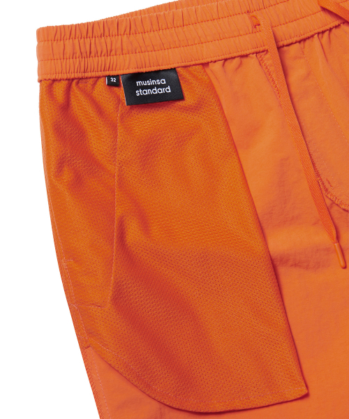 MUSINSA STANDARD（ムシンサスタンダード）の「ナイロンバンディングショーツ_7.5インチ [オレンジ]（その他パンツ・メンズ・その他・26）」の5枚目の写真