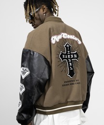 HARSH AND CRUEL | A'GEM/9 × .kom『Harsh and Cruel/ハーシュアンドクルーエル』クロスデザイン ブルゾン スタジャン(スタジャン)