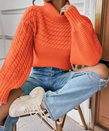 （あん）ホワイトオレンジ柄、ニット素材 andme（アンドミー）の「長袖ショート丈ボーダーニット（ニット