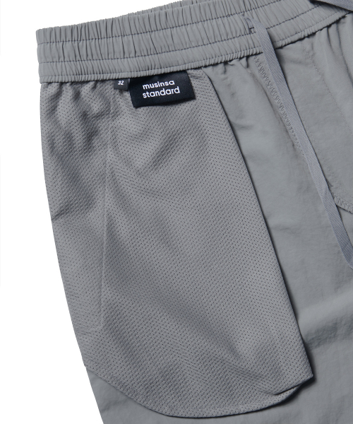 MUSINSA STANDARD（ムシンサスタンダード）の「ナイロンバンディングショーツ_7.5インチ [ライトグレー]（その他パンツ・メンズ・その他・38/36/34/26/28/32/30）」の5枚目の写真