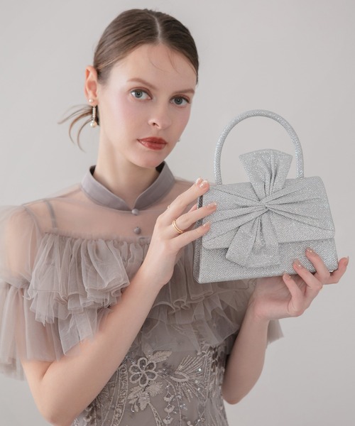 Leja(レジャ)の「【LEJA】グリッタービッグリボン2WAYハンドバッグ結婚式 パーティー 成人式 二次会 同窓会 お呼ばれ オケージョン 20代 30代(ハンドバッグ・レディース・シルバー・FREE)」の1枚目の写真