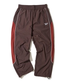 Reebok（リーボック）の「【Reebok / リーボック】セットアップ対応 パイピング切替 ナイロントラックパンツ（その他パンツ）」