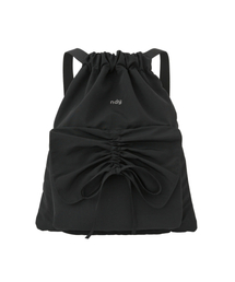 NDY（エヌディーワイ）の「リボンシャーリングドローストリングブラック（バックパック/リュック）」