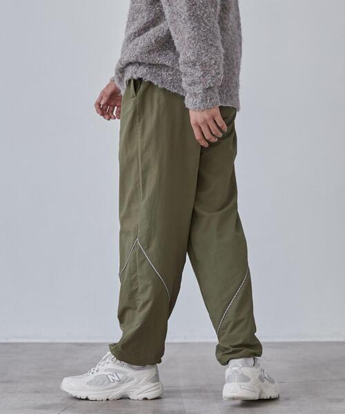 coen(コーエン)の「California Sportswear(カリフォルニアスポーツウェア)別注ナイロントラックパンツ(セットアップ対応)(その他パンツ・メンズ・オリーブ/ブラック・M/XL/L)」の16枚目の写真