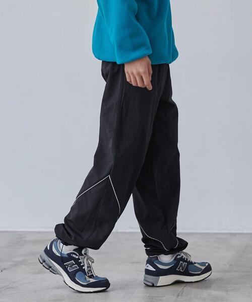 coen(コーエン)の「California Sportswear(カリフォルニアスポーツウェア)別注ナイロントラックパンツ(セットアップ対応)(その他パンツ・メンズ・オリーブ/ブラック・M/XL/L)」の18枚目の写真