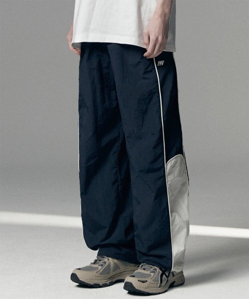 NOT4NERD(ノットフォーナード)の「Nylon Racing Pants - Navy(スウェットパンツ・レディース・その他・LARGE/MEDIUM/SMALL/X-LARGE)」の1枚目の写真