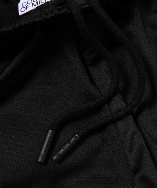 MARCELO BURLON（マルセロ・バーロン）の「TEMPERA CROSS LOOSE TRACKPANT（その他パンツ・メンズ・ブラック×ホワイト・M/L）」の2枚目の写真