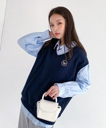 muahmuah（ムーアムーア）の「A'GEM/9 × .kom『muah muah/ムーアムーア』STITCH MUAH SWEAT VEST/ステッチ スウェット素材ベスト（ベスト）」