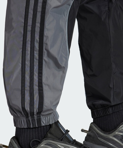 adidas アディダス R.Y.V. ウーブン トラックパンツ (ジャージ) adidas（アディダス）の「R.Y.V. Vライン ウーブン トラックパンツ