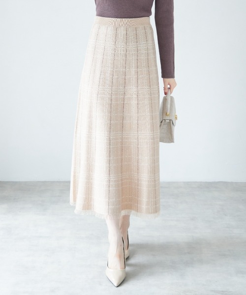 tocco closet(トッコ クローゼット)の「裾フリンジチェック柄ニットフレアロングスカート(スカート・レディース・ベージュ/アイボリー/ブラック・M)」の1枚目の写真