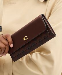 COACH（コーチ）の「ミラ ロング フラップ ウォレット・シグネチャー キャンバス（財布）」