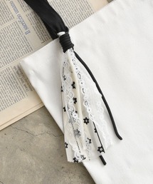 styiro（スタイロ）の「レース・リボンMIXヤーンタッセルチャーム（チャーム）」